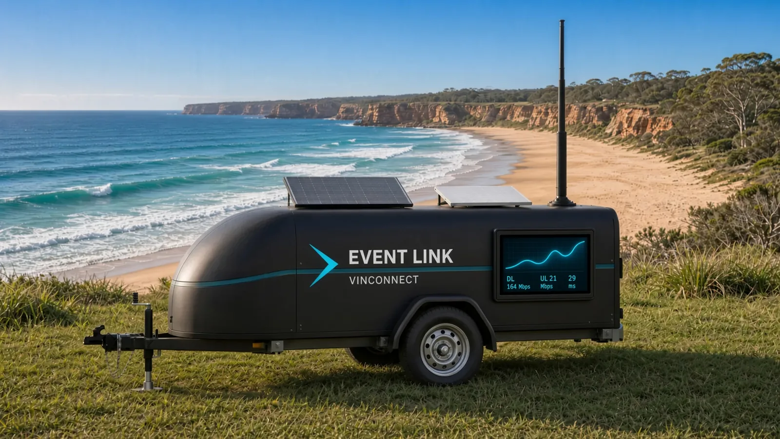 The branded mid-size Event Link trailer above an Australian beach.