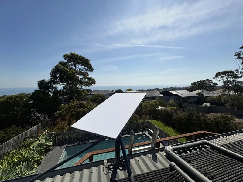Starlink Standard dish on a tripod on a corrugated metal roof in Mount Martha