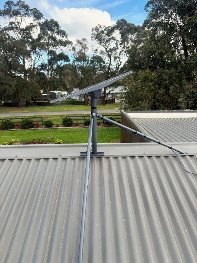 Starlink Standard dish on a tripod on a corrugated roof in Nyora
