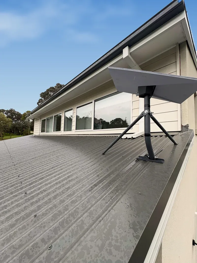 Starlink Standard dish on a tripod on a Colorbond roof in Pakenham Upper