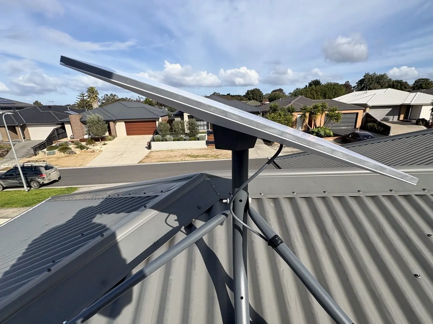 Starlink tripod on the Somerville metal roof.