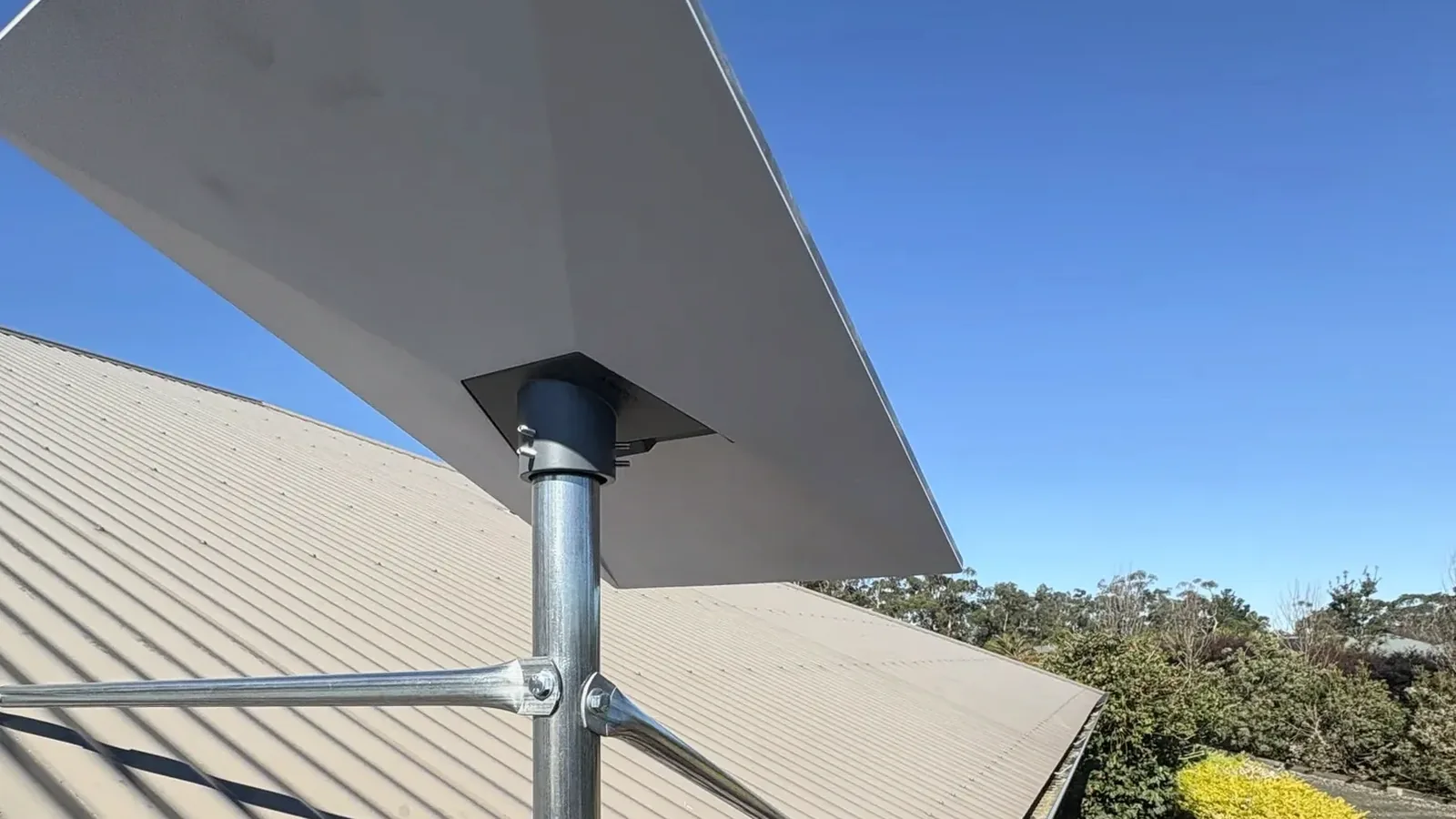 Starlink Standard dish on a metal roof.